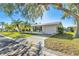 Charming mid-century modern home with lush landscaping at 14198 89Th Ave, Seminole, FL 33776