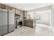Modern kitchen with stainless steel appliances and light wood cabinets at 14198 89Th Ave, Seminole, FL 33776