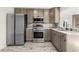 Modern kitchen with stainless steel appliances and light wood cabinets at 14198 89Th Ave, Seminole, FL 33776