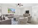 Living Room with light walls and gray sectional sofa at 14198 89Th Ave, Seminole, FL 33776