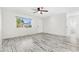 Bright living room with hardwood floors and ceiling fan at 14198 89Th Ave, Seminole, FL 33776