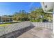 Private patio with decorative block wall and view of neighborhood at 14198 89Th Ave, Seminole, FL 33776
