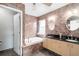 Main bathroom with double vanity and tub at 1600 Gray Bark Dr, Oldsmar, FL 34677