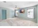 Spacious bedroom with ceiling fan and carpet at 1600 Gray Bark Dr, Oldsmar, FL 34677