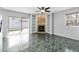 Gathering room with fireplace and sliding doors to backyard at 1600 Gray Bark Dr, Oldsmar, FL 34677