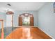 Hardwood floor living room with large window and shutters at 1600 Gray Bark Dr, Oldsmar, FL 34677