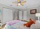 Cozy bedroom with double bed, built-in closet, and ceiling fan at 1832 San Mateo Dr, Dunedin, FL 34698