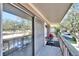 Private balcony with red grill and views of the parking lot at 1849 Bough Ave # D, Clearwater, FL 33760