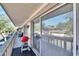 Private balcony with a red grill and views of the surrounding area at 1849 Bough Ave # D, Clearwater, FL 33760