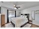 Main bedroom with a king-size bed and ceiling fan at 1849 Bough Ave # D, Clearwater, FL 33760