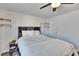Bedroom with king-size bed, ceiling fan, and walk-in closet at 1849 Bough Ave # D, Clearwater, FL 33760