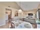 Bright dining area with table and chairs, open to kitchen and living room at 1849 Bough Ave # D, Clearwater, FL 33760