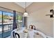 Dining area with round table, chairs, and view to patio at 1849 Bough Ave # D, Clearwater, FL 33760