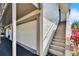 Side view of a condo with a garage and stairs at 1849 Bough Ave # D, Clearwater, FL 33760