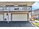 Condo building with attached garage and balcony at 1849 Bough Ave # D, Clearwater, FL 33760
