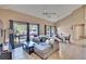 Living room with sectional sofa, coffee table, and view to dining area at 1849 Bough Ave # D, Clearwater, FL 33760