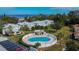 Community pool with surrounding patio and adjacent buildings at 1849 Bough Ave # D, Clearwater, FL 33760