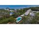 Community pool, waterfront, and surrounding buildings at 1849 Bough Ave # D, Clearwater, FL 33760
