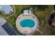 Aerial view of kidney-shaped community pool with surrounding lounge chairs at 1849 Bough Ave # D, Clearwater, FL 33760