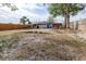 Fenced backyard with play area and mature trees at 1907 27Th W St, Bradenton, FL 34205