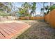 Backyard with deck and wooden fence at 1907 27Th W St, Bradenton, FL 34205