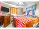 Bedroom with a dresser, tv, and a large bed at 1907 27Th W St, Bradenton, FL 34205