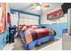 Spacious bedroom with a ceiling fan and ample closet space at 1907 27Th W St, Bradenton, FL 34205