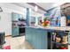 Modern teal kitchen with stainless steel appliances at 1907 27Th W St, Bradenton, FL 34205