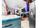Island kitchen with teal cabinets and granite countertops at 1907 27Th W St, Bradenton, FL 34205