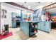 Updated kitchen with teal cabinets and a large island at 1907 27Th W St, Bradenton, FL 34205