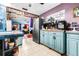 Bright teal kitchen with ample counter and cabinet space at 1907 27Th W St, Bradenton, FL 34205
