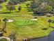 Golf course aerial showing players on the green at 225 Country Club Dr # B121, Largo, FL 33771