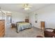 Comfortable bedroom with a ceiling fan and plenty of storage at 2460 Franciscan Dr # 50, Clearwater, FL 33763