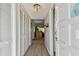 Condo entryway with built-in storage and wood floors at 2460 Franciscan Dr # 50, Clearwater, FL 33763