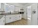 White kitchen with granite counters and stainless steel sink at 2460 Franciscan Dr # 50, Clearwater, FL 33763