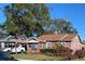 Brick home with carport and well-maintained lawn at 2504 Highland S St, St Petersburg, FL 33705