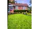 Neatly landscaped front yard with lush green grass at 2504 Highland S St, St Petersburg, FL 33705