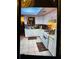 Kitchen with white cabinets, white appliances, and tiled floor at 2504 Highland S St, St Petersburg, FL 33705