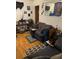 Living room with dark-colored couch and wood flooring at 2504 Highland S St, St Petersburg, FL 33705