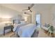 Bright bedroom with ceiling fan,light flooring, and en-suite bathroom at 2617 48Th S St, Gulfport, FL 33711