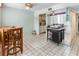 Condo dining area with kitchen views and small table with chairs at 2630 Pearce Dr # 102, Clearwater, FL 33764