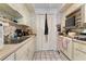 Small condo kitchen with white cabinets and appliances at 2630 Pearce Dr # 102, Clearwater, FL 33764