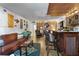 Living room with wet bar, seating area, and brick accent wall at 2630 Pearce Dr # 102, Clearwater, FL 33764