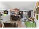 Living room with wet bar, seating area, and brick accent wall at 2630 Pearce Dr # 102, Clearwater, FL 33764