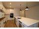 Modern kitchen with white cabinets and stainless steel appliances at 32382 Carmela S Cir, San Antonio, FL 33576