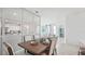 Open dining room with mirrored wall, view into living room and kitchen at 32646 Rustic Rise Rd, San Antonio, FL 33576