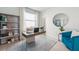 Modern home office with built-in shelving and comfortable seating at 32646 Rustic Rise Rd, San Antonio, FL 33576