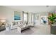 Open concept living room with neutral color palette and natural light at 32646 Rustic Rise Rd, San Antonio, FL 33576