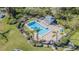 Community pool with lounge chairs and cabana at 327 Petrea Dr # 327, Palm Harbor, FL 34684