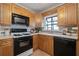 Well-equipped kitchen with light wood cabinets and gas stove at 3616 W Morrison Ave, Tampa, FL 33629